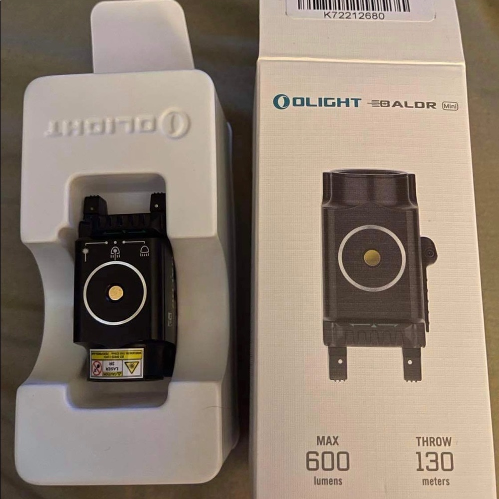 Olight Baldr mini light & green laser combo..Like new in box…